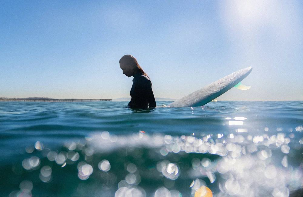 Open-water swimmer at dawn